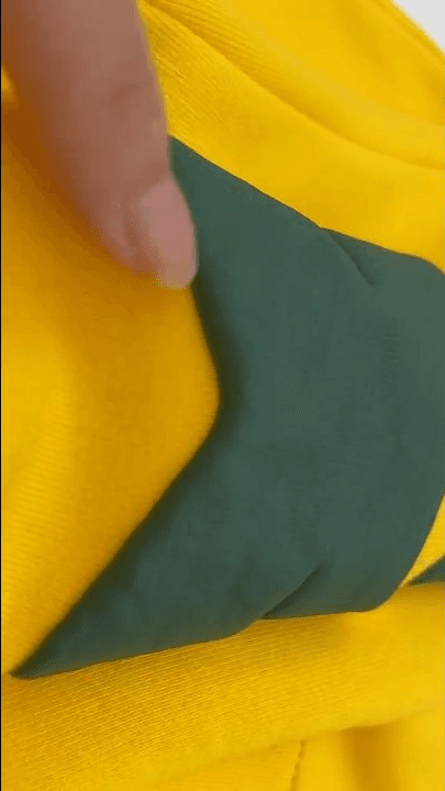 Close-up showing the lifted edge and height of dark green puff-print ink