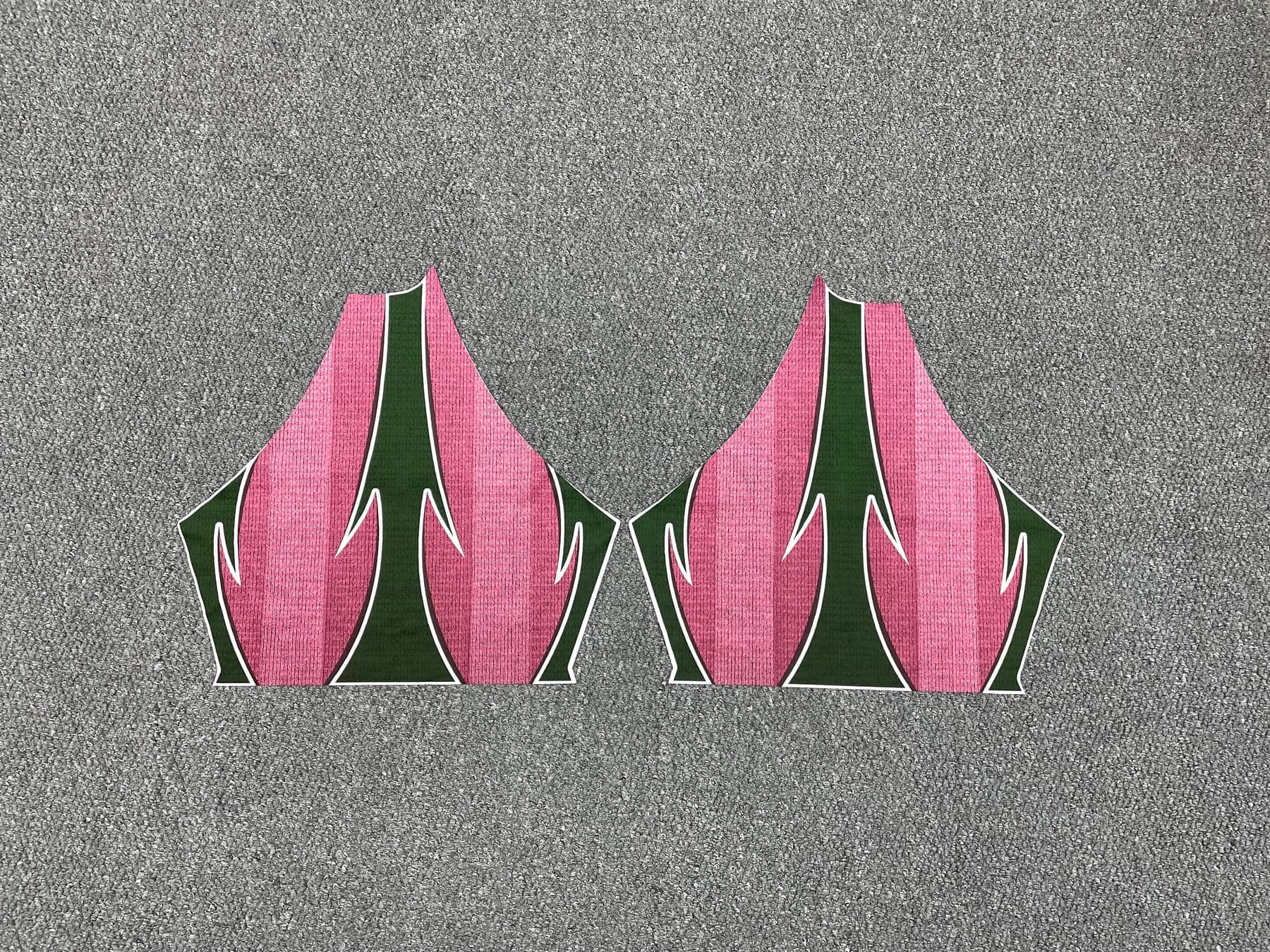 Pair of shaped printed garment panels laid out for placement comparison