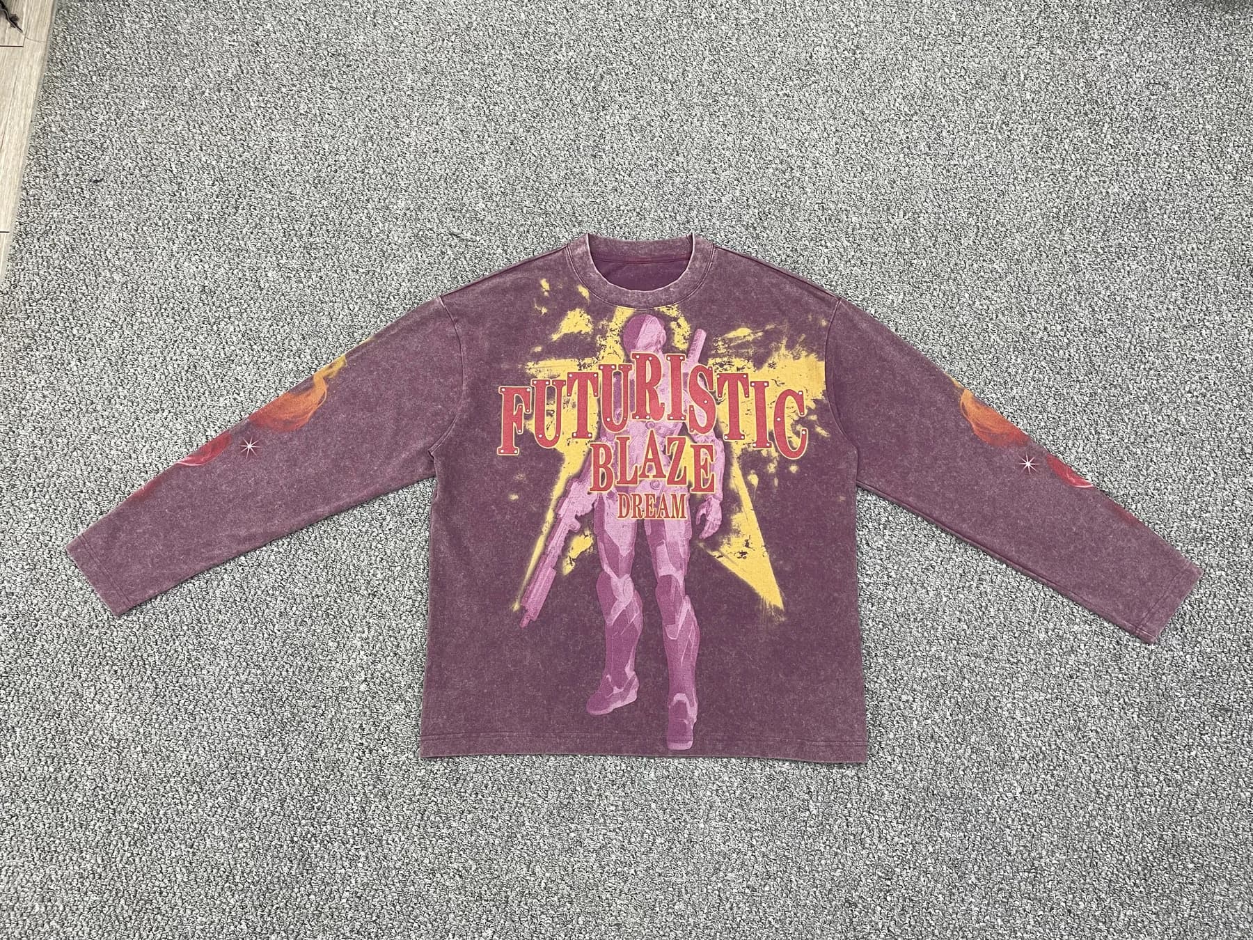 Purple vintage-wash long-sleeve graphic T-shirt laid flat